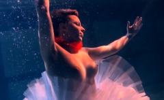 Bulava Lozhkova with a red tie and skirt underwater