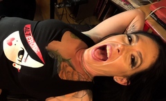 Marie Bossette touches herself while being tattooed