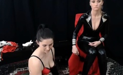 Sexy brunette lesbians in stockings strap on fucking