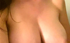 Busty curly brunette with big boobs fucks on couch